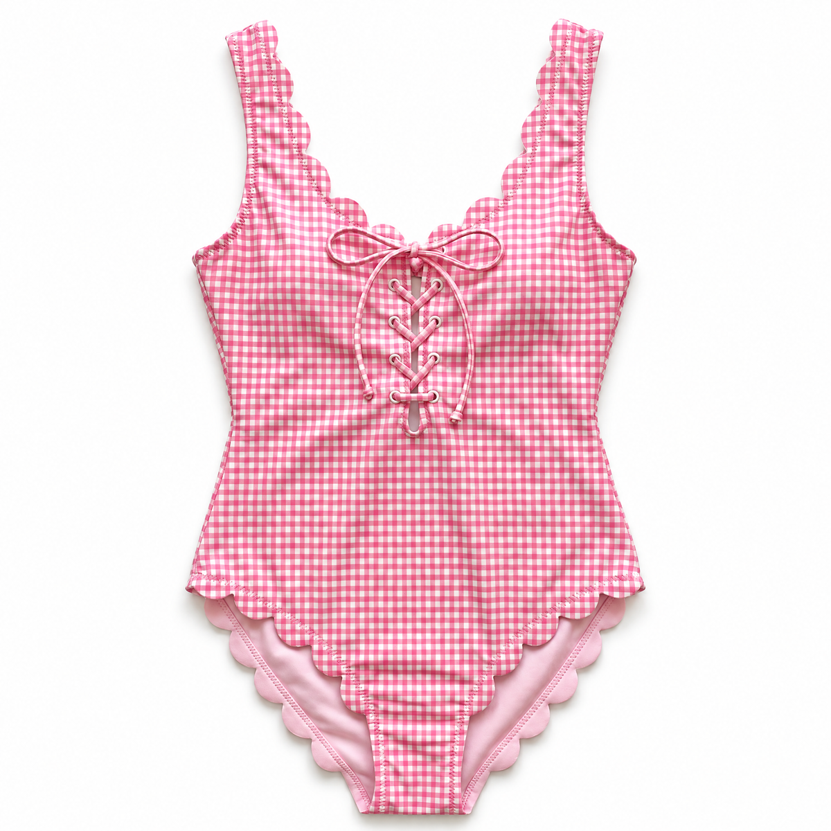 Pink and white gingham one-piece swimsuit with scalloped edges and lace-up front detail, shown flat on a white background.
