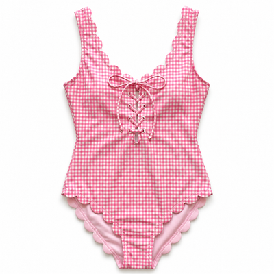 Pink and white gingham one-piece swimsuit with scalloped edges and lace-up front detail, shown flat on a white background.